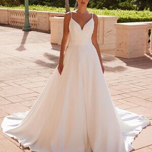 Simple satin like white wedding dress. bridal gown